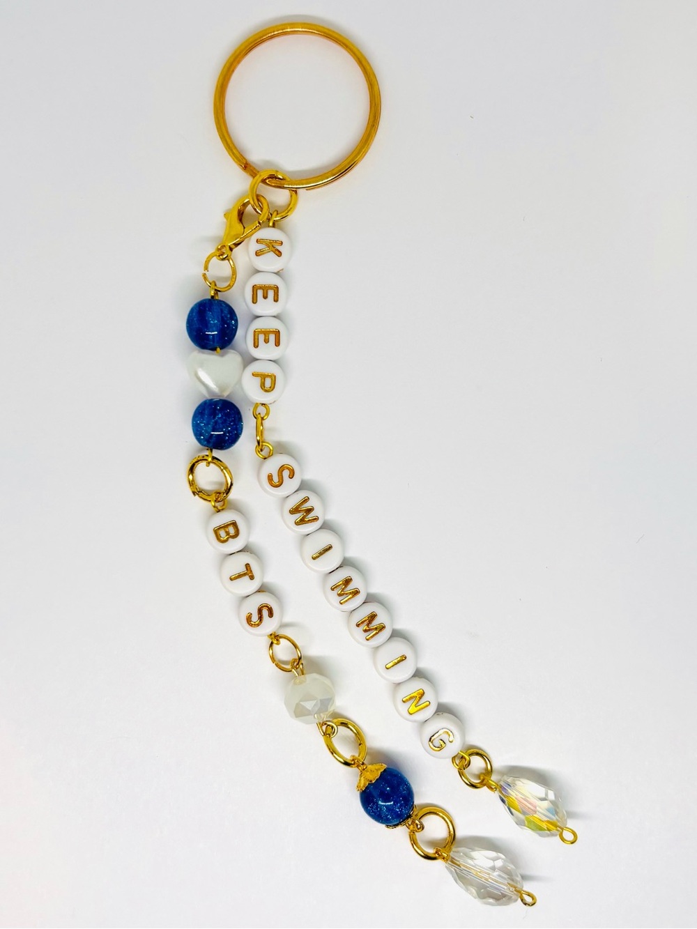 BTS 'KEEP SWIMMING' GOLD KEYCHAIN